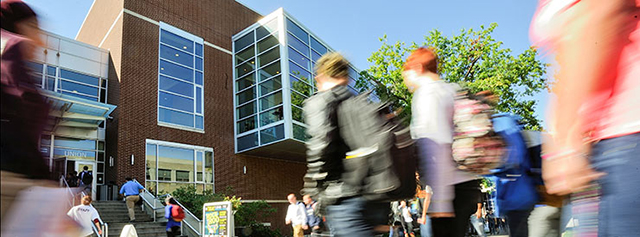 Students enter a building to learn about The University of Akron admissions process.