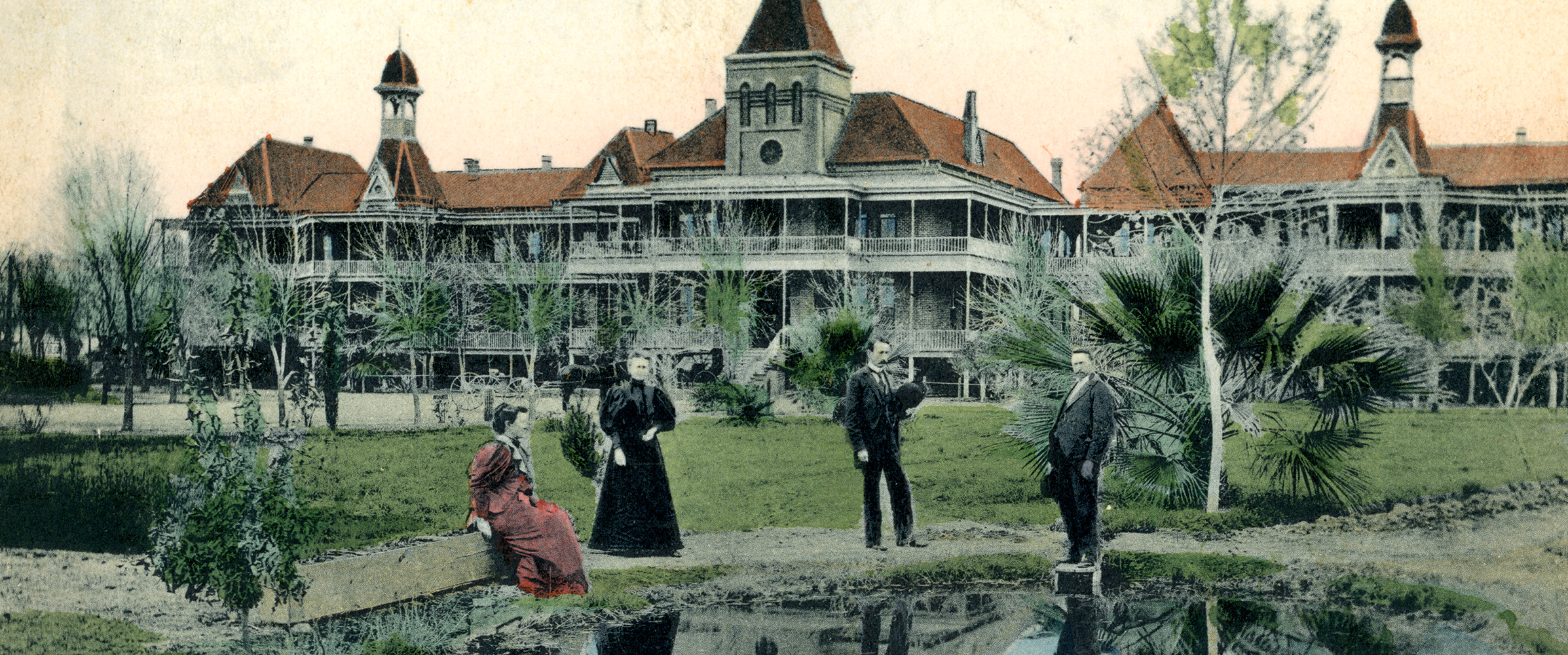 A postcard image of a large asylum building