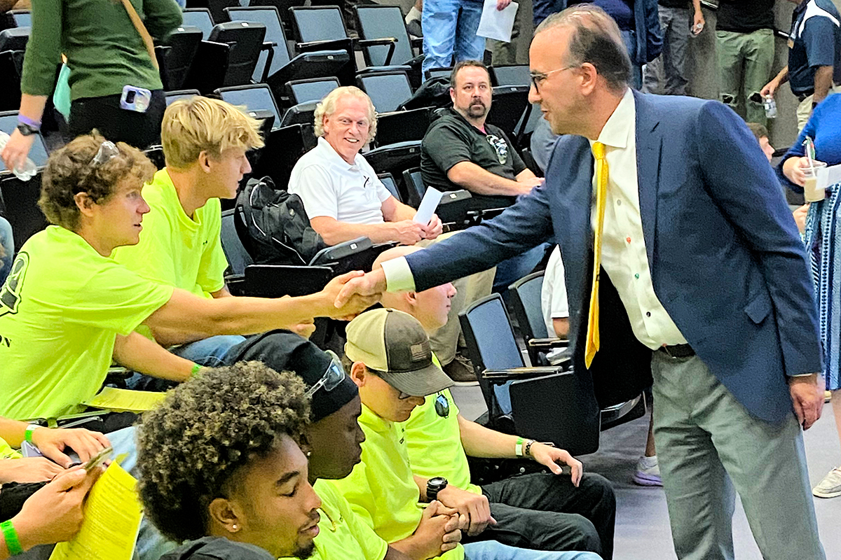 UA President R.J. Nemer greets students before the start of the Construction Olympics.