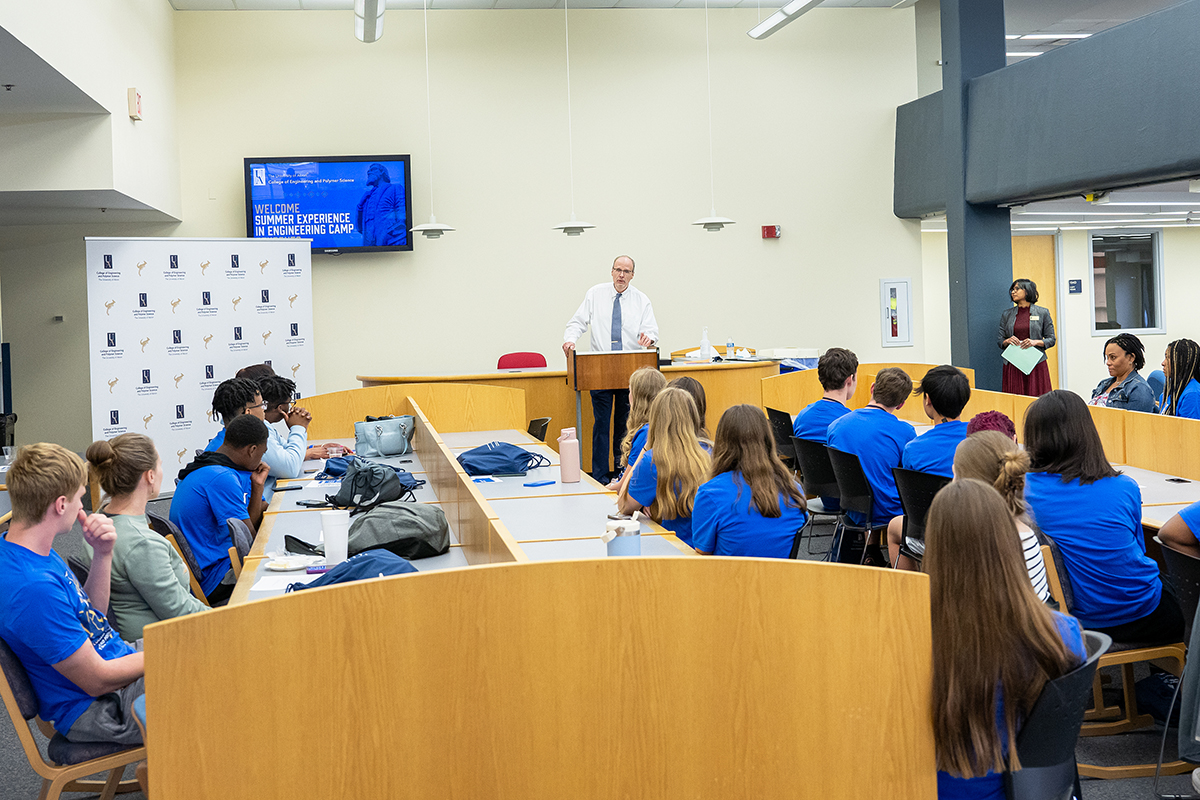 Dean Craig Menzemer talks with campers at the cerficiate ceremony.