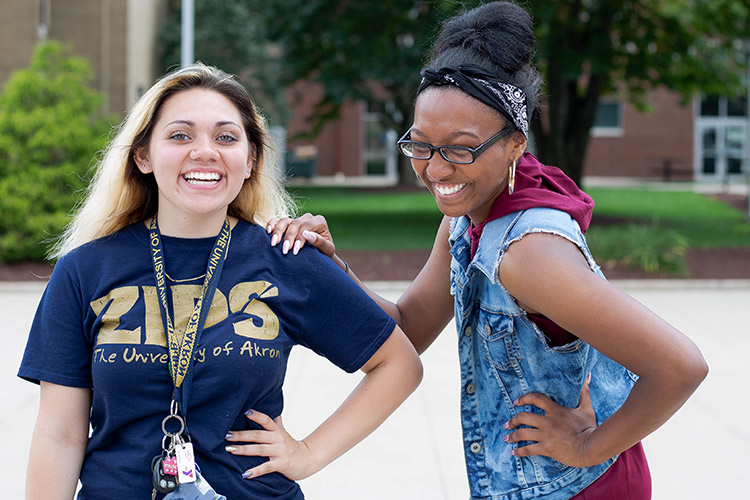 Two students from the Williams Honors College share a laugh in the common space on the North Quad