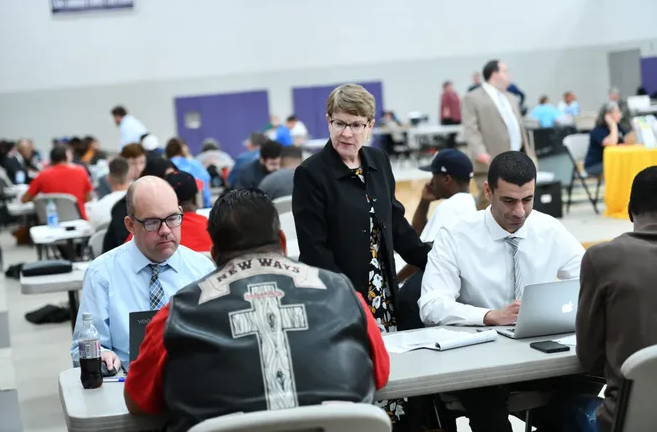 Akron law faculty and students help a clients at a reentry clinic event in the city.