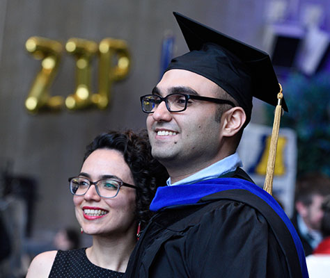 Man obtaining his degree during graduation