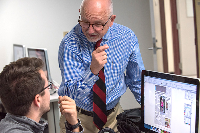 University of Akron School of Communication Professor Pipps teaching a public relations UA student.